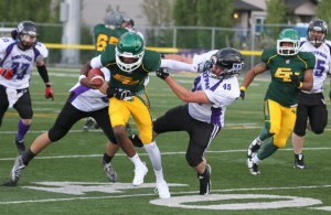 Fort McMurray Monarchs quarterback Charles Drinkard stiff arms Bailey Grabmuller of the Calgary Wolfpack on his way up field with the ball during Alberta Football League action at Fuhr Field in Spruce Grove Alta. on Saturday May 28, 2016. The Monarchs defeated the Wolfpack 66-0 to open their 2016 season Saturday night. Robert Murray/Fort McMurray Today/Postmedia Network