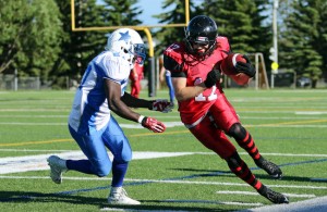 Josh Blanchard of the Central Alberta Buccaneers tries to evade a tackle by Randy McLean of the St. Albert Stars during AFL action at M.E. Global Field Saturday evening. The Bucs defeated the Stars 41-8, extending their season record to 3-0. Ashli Barrett/Lacombe Globe/Postmedia Network