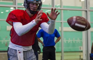 Fort McMurray Monarchs quarterback Will Arndt prepares to receive a snapped ball during a drill at practice at Shell Place in Fort McMurray Alta. on Wednesday June 15, 2016. Robert Murray/Fort McMurray Today/Postmedia Network