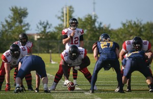 Central Alberta Buccaneers starting quarterback Brandon Leyh surveyed the field for an open receiver during a game earlier this season in Lacombe. — Image Credit: Zachary Cormier/Lacombe Express