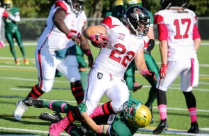 Jeffree Rogers of the Central Alberta Buccaneers tries to push through a tackle by his Airdrie Irish opponent during Saturday evening AFL action at M.E. Global Field. The Bucs defeated the Irish 77-10. (Ashli Barrett, Lacombe Globe)