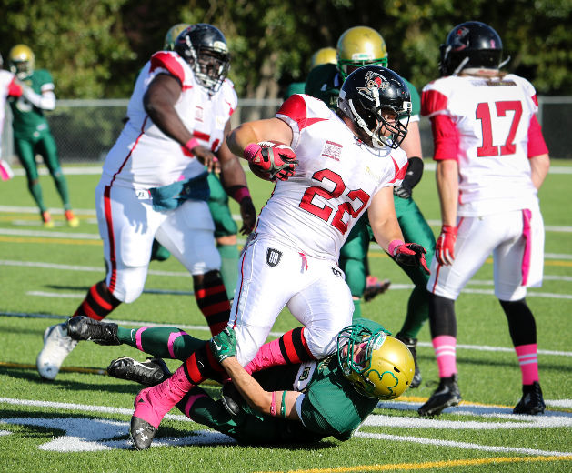 Jeffree Rogers of the Central Alberta Buccaneers tries to push through a tackle by his Airdrie Irish opponent during Saturday evening AFL action at M.E. Global Field. The Bucs defeated the Irish 77-10. (Ashli Barrett, Lacombe Globe)