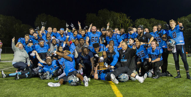 The Fort McMurray Monarchs pose with the championship trophy after defeating the Central Alberta Buccaneers 32-23 in Saturday's championship game in Lacombe. Robert Murray/Fort McMurray Today/Postmedia Network